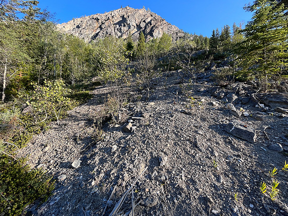 Traversing south slopes to the SE ascent gully.