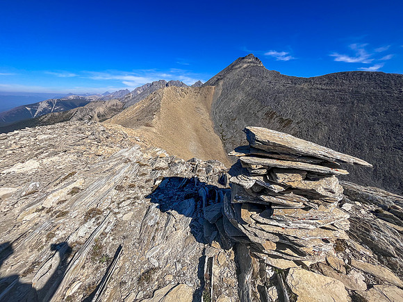 Views to the summit and SW face from the top of the SE ridge.