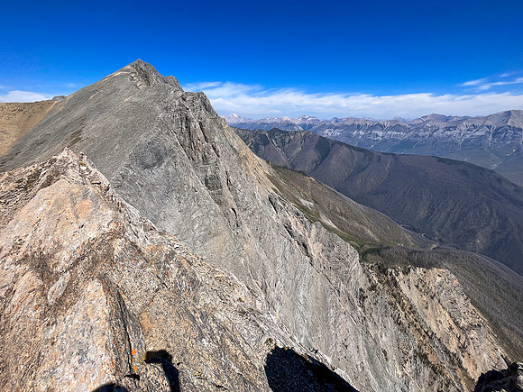 Traversing from the upper SW face to the top of the SE ridge.