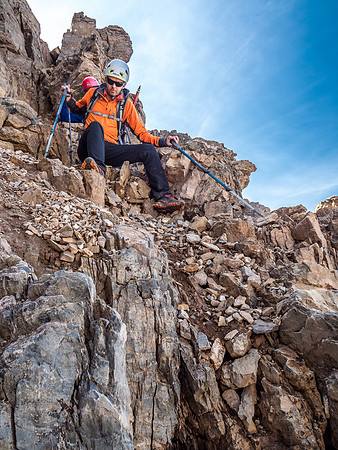 More down climbing on loose terrain as we bypass the north ridge on the west side.