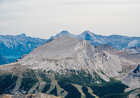 Eagle Mountain with Lake Minnewanka just visible at lower left and Inglismaldie and Girouard looming above it in the distance.