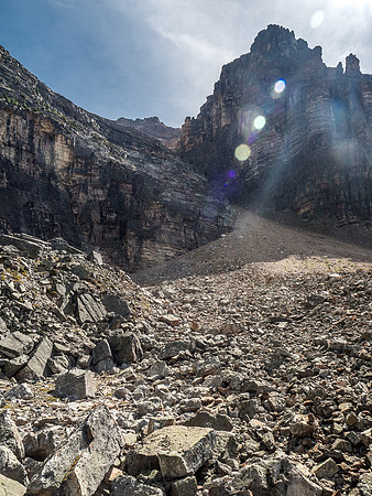The scree cone leading to the gully looks pretty innocent now that we're a ways away from it, across the rubble field.