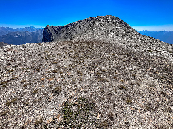 Traversing from the upper SW face to the top of the SE ridge.