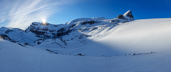 The sun rises over Vulture Peak with St. Nicholas at right.