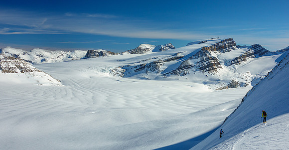 Skiing the steep NE face below the col.