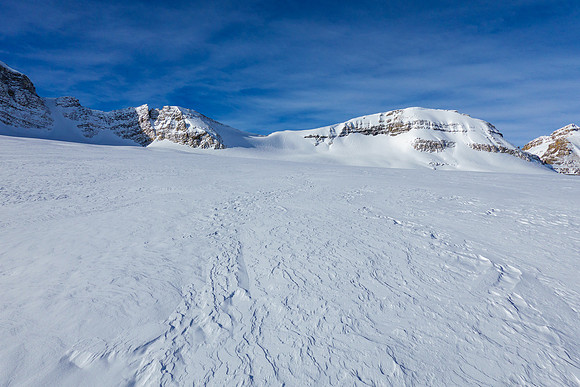 Skiing to the NE access slope.