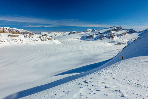 Skiing the steep NE face below the col.