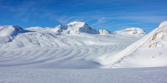 Skiing down to the western plateau under Mount Collie.