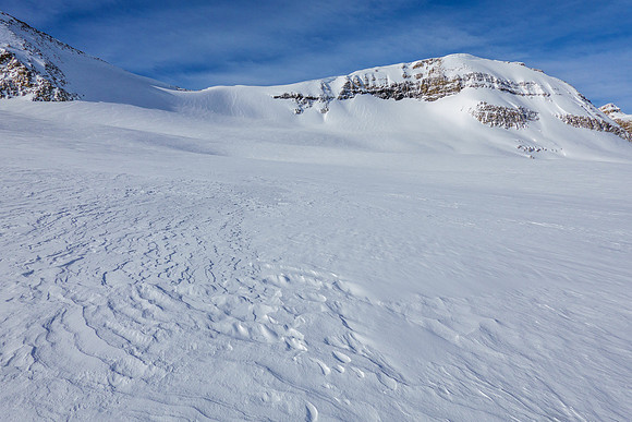 Skiing to the NE access slope.