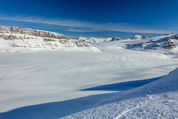 Skiing the steep NE face below the col.