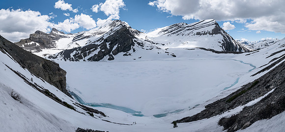 Still traversing the lake - note the cliff bands on the L that you must traverse above. Coleman at center here.