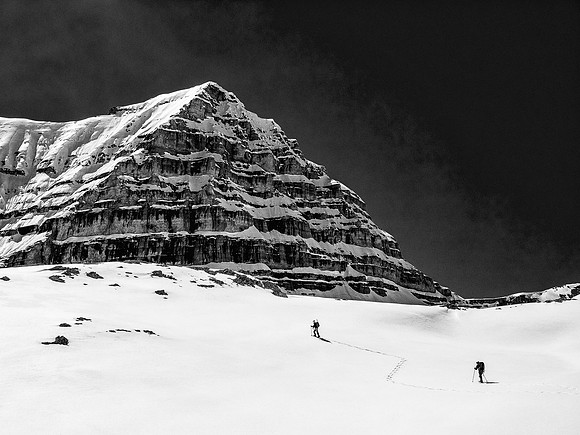 Impressive terrain as Ben climbs a snow slope in front of one of the south outlier peaks of Cirrus.