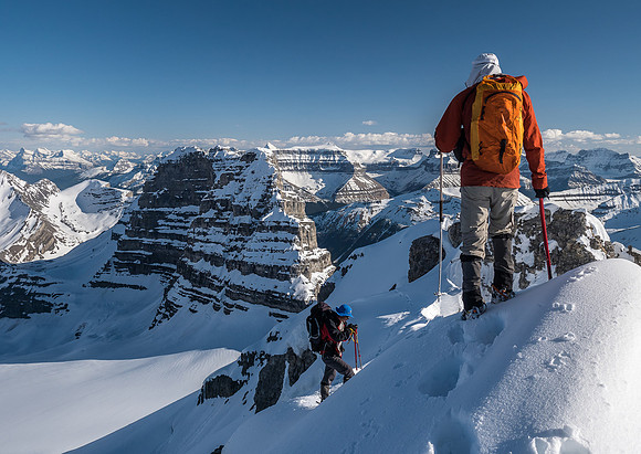 Ben waits for Steven while taking in the wondrous views off the descent ridge.