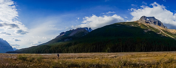Eric crosses the last of the river flats with Amery rising on the right.