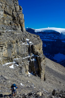 Eric starts up the final gully breaking through the upper cliff band.