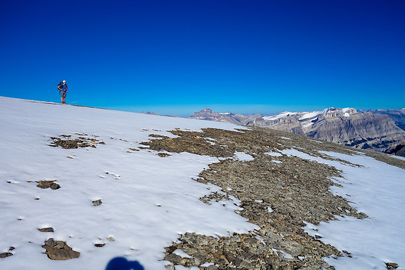 Eric stands at our chosen bivy location, high on the SE shoulder of Amery's summit plateau - over 10,500 feet high.