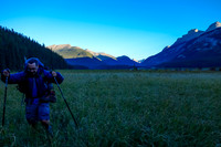 He's smiling but that doesn't mean he's enjoying himself - it's more of a grimace of pain due to glacial riverwater and bare legs