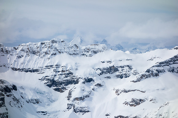 Looking over at the Valley of Ten Peaks rising in the clouds behind Chimney.