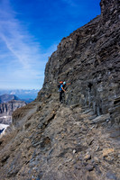 Little ledges are the key to working your way down the face, traversing back and forth breaks the many cliff bands.