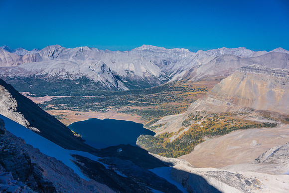 View of Lake Magog and the Assiniboine huts from Strom's south ridge. The Hind hut is also visible in the shadows.