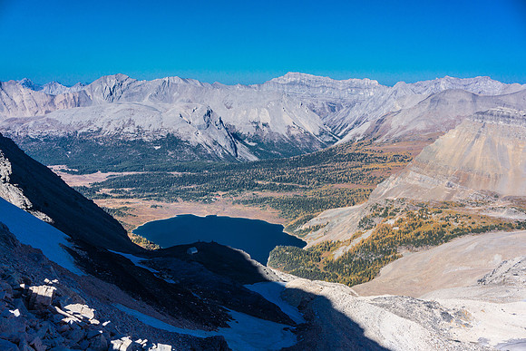 View of Lake Magog and the Assiniboine huts from Strom's south ridge. The Hind hut is also visible in the shadows.