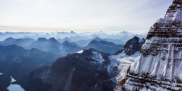 One of my favorite pano's from all my climbs - looking across the east face / ridge of Assiniboine at a smoky morning sunrise.
