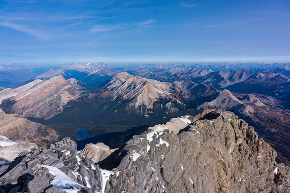 Kev tops out on the ridge in this view from the false summit - barely visible though in the huge terrain.