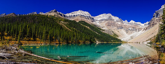 Assiniboine Lake is gorgeous! We have to go around on climber's right and then up the large scree slope up to the right side of the photo on lighter scree.