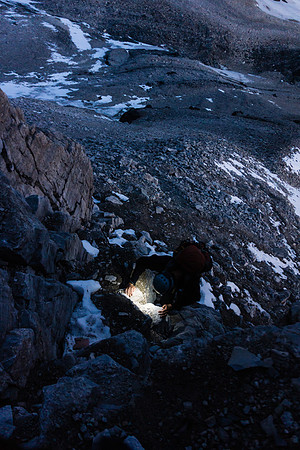 Kev climbing via headlamp on the lower ridge.