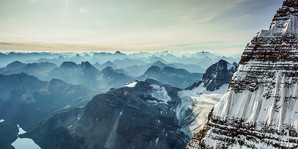 One of my favorite pano's from all my climbs - looking across the east face / ridge of Assiniboine at a smoky morning sunrise.