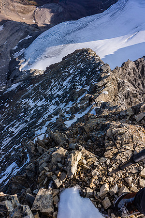 Kev climbs the north ridge of Assiniboine.