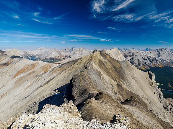 Scrambling to the summit of Wonder Peak. Views back over Ely's Dome and Mount Cautley.