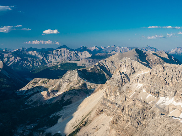Aurora Peak at foreground right with Byng rising above. Familiar Spray Lakes peaks in the distance including Cone, Old Goat, Sparrowhawk and Bogart.