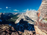 Views off the col into the core Assiniboine area including Wonder Peak at distant left, Marvel at center, Aurora and Byng at right.