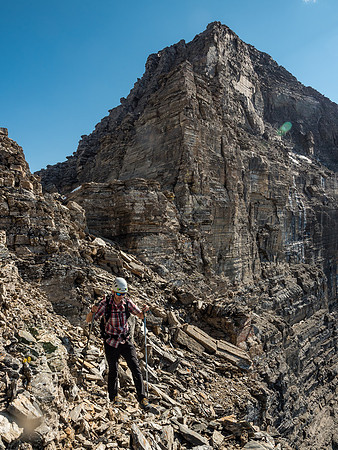 Continuing the loose descent past the crux which rises above Phil.