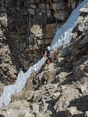 Phil transitions out of our ascent gully onto the really manky dirt / rock slope between the two snow gullies.