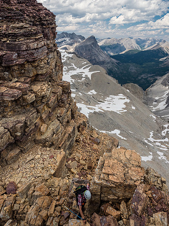 Phil comes up the blocky, moderate step to the ridge crest. It may look pretty loose - and it was - but this is as solid as these mountains get!