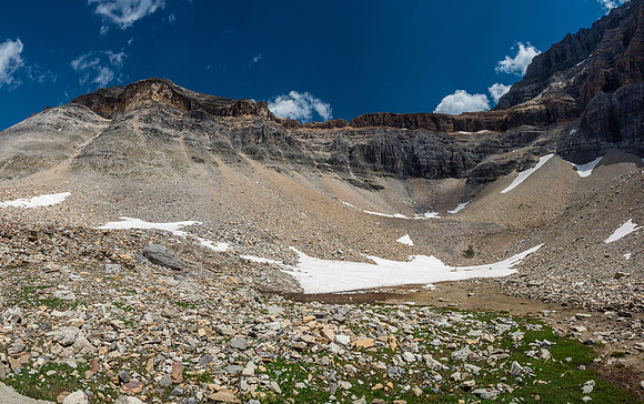 We initially thought climber's right via the snow before traversing way to the left and then up to the crest. As we got closer, however, the cliffs just left of center started appealing more.