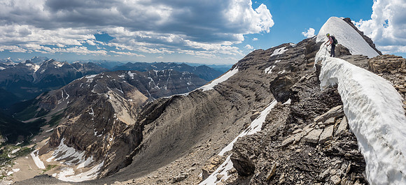 Dang it! Nothing's ever easy is it?! To avoid unnecessary exposed snow climbing along the obvious ar�te ahead, we chose to dip down to the left and ascend to the summit that way.