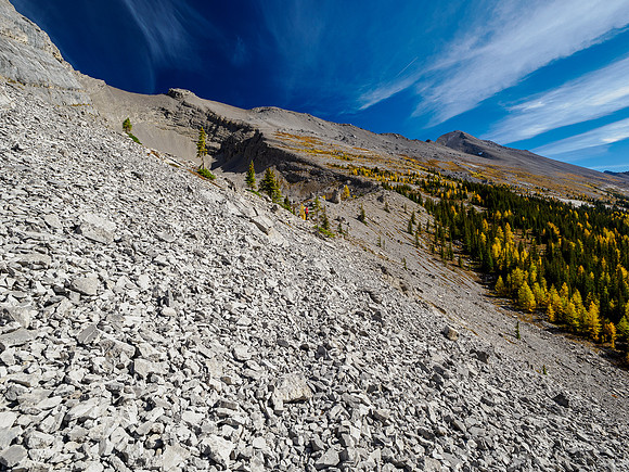 Hiking around the south cliffs of Golden Mountain towards a south bowl under Nasswald Peak.