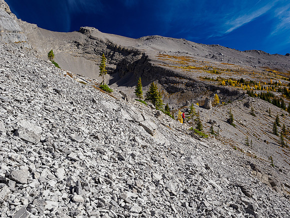 Hiking around the south cliffs of Golden Mountain towards a south bowl under Nasswald Peak.