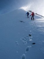 Anton and Mike ascending the end of the snow arete that leads to the final summit slopes (visible at upper right)
