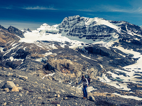 Anton crests the upper moraine with Forbes in the distance.