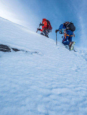 Breaking up onto the summit shoulder above the rock band that we bypassed on snow.