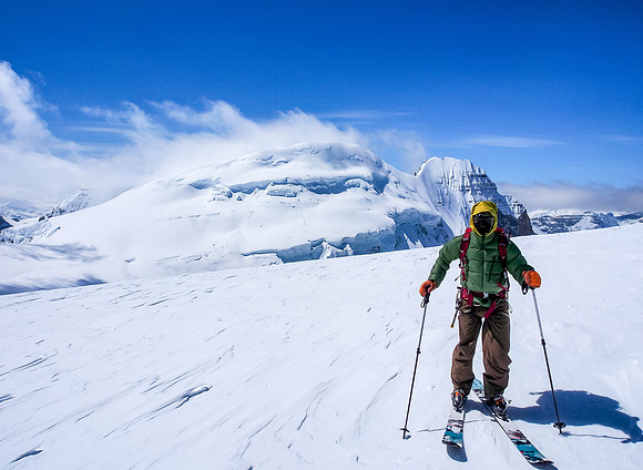 This image shows that despite appearances it was cold in the wind - note he's wearing his down jacket and full Gore-Tex.