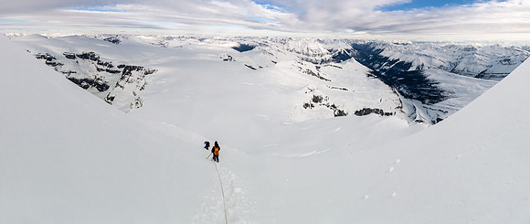 This photo makes the slope look shallow - it's not! Steven is crossing the open crevasse that Ben was half buried in on the ascent.