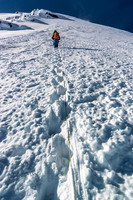 Off the skis and roped up for the SE face snow ascent. It's starting to look big again.