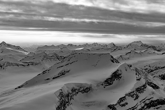 The long SW ridge of King Edward rises from the icefield to the summit at lower left to center with the east face at center