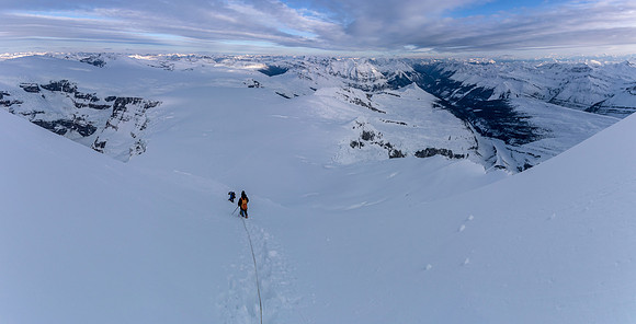 This photo makes the slope look shallow - it's not! Steven is crossing the open crevasse that Ben was half buried in on the ascent.