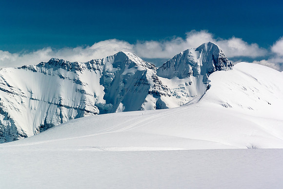 Looking south towards Mount Bryce over an intervening unnamed peak with the snowmobile approach tracks.